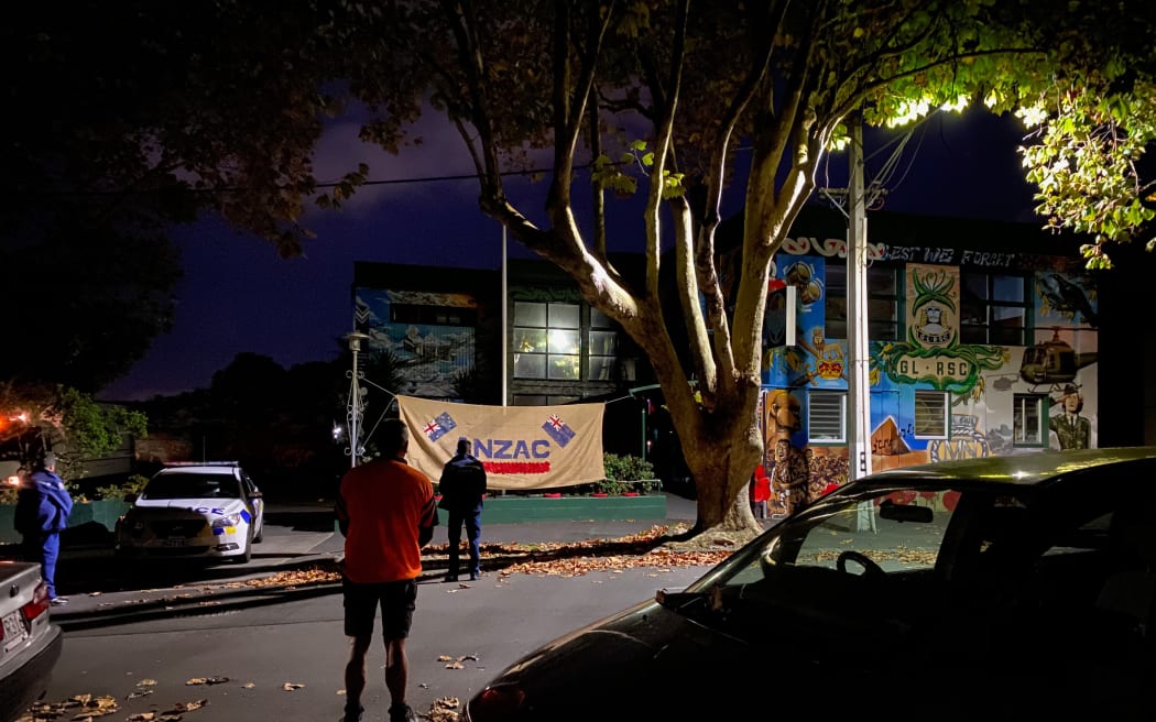 People gather outside the Grey Lynn RSC on ANZAC Day 2020.