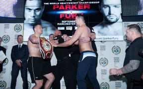 Boxers Joseph Parker and Hughie Fury scuffle during their pre-bout weigh-in