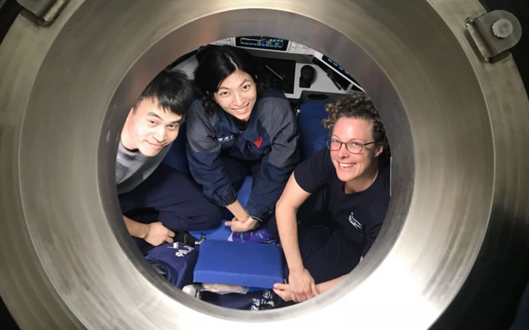 Ready for deployment to the Scholl Deep, from left to right, HOV Fendouzhe pilots Xin Yuan and Yuqing Deng with Kareen Schnabel (NIWA).
