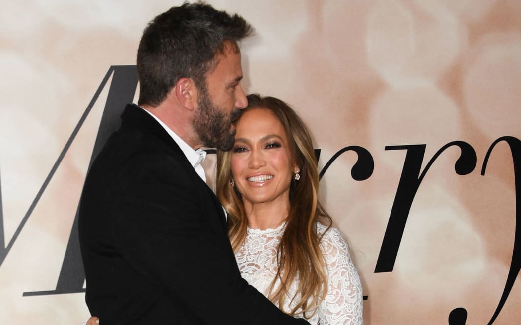 US actress Jennifer Lopez and actor Ben Affleck arrive for a special screening of "Marry Me" at the Directors Guild of America (DGA) in Los Angeles, February 8, 2022. (Photo by VALERIE MACON / AFP)