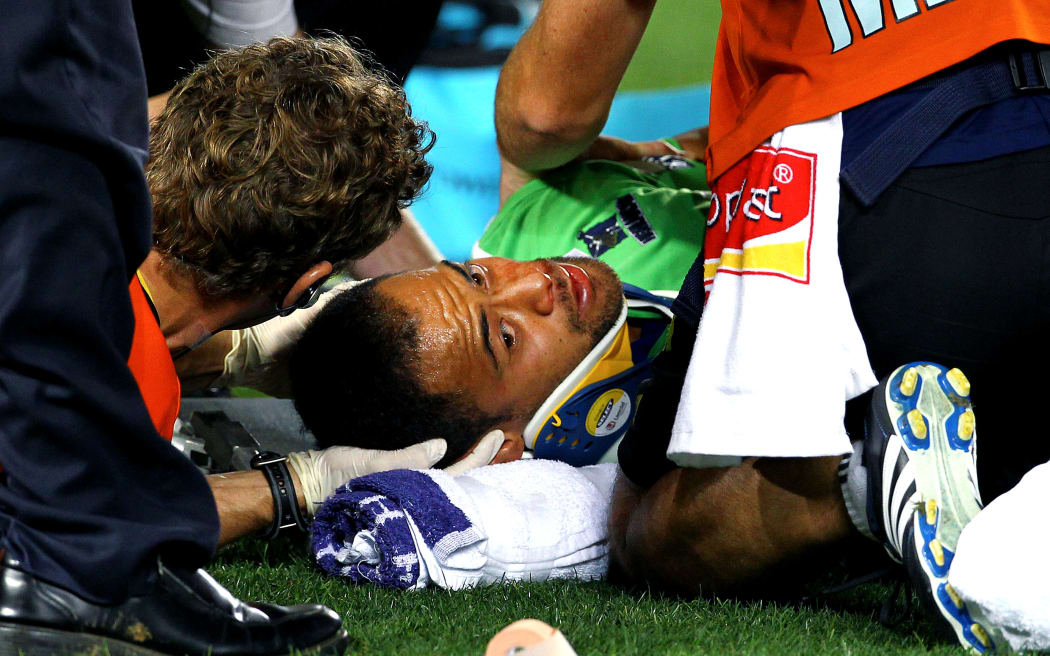 The Highlanders' Buxton Popoalii suffers a head injury during a Super Rugby match.
