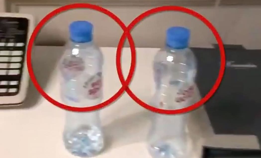 This grab taken from a video posted on September 17, 2020 on the Instagram account of @navalny shows bottles of Svyatoi Istochnik, or Holy Spring, mineral water, in the hotel room where opposition leader Alexei Navalny stayed during his visit to the Siberian city of Tomsk.