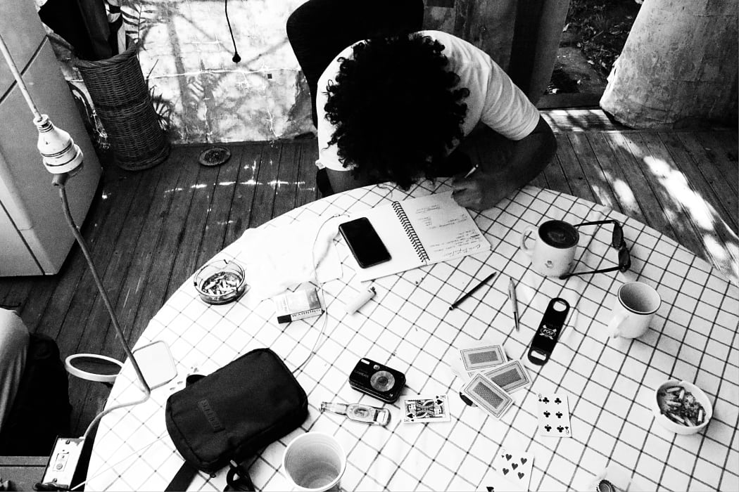 Diggy Dupé writing at home.