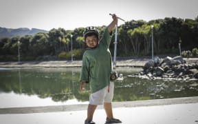 Dre Piki-Lyttle (7) lifts his scooter of the ground at one of The Green Prescription Active Family days in Porirua. The Programme is run by Sport Wellington nationwide.