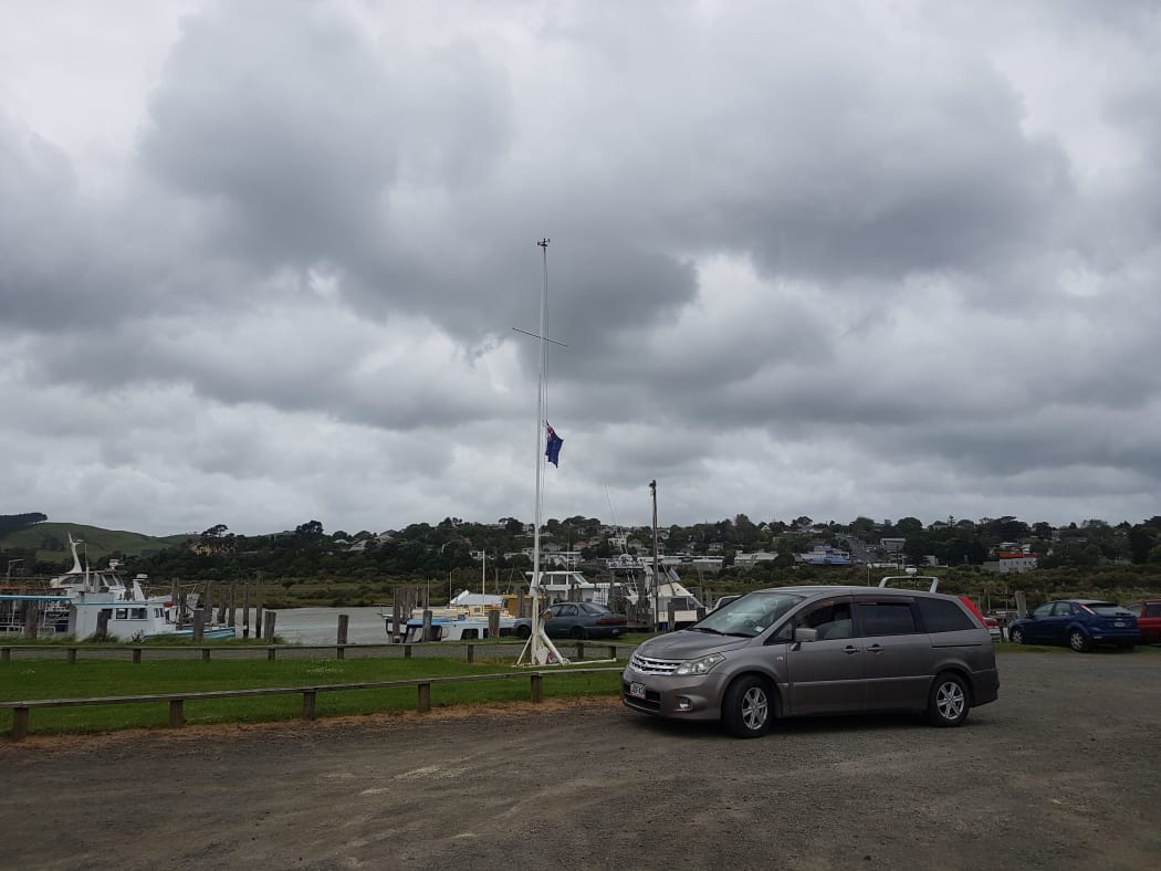 The flag at the Kaipara boat and fishing club being flown at half-mast.