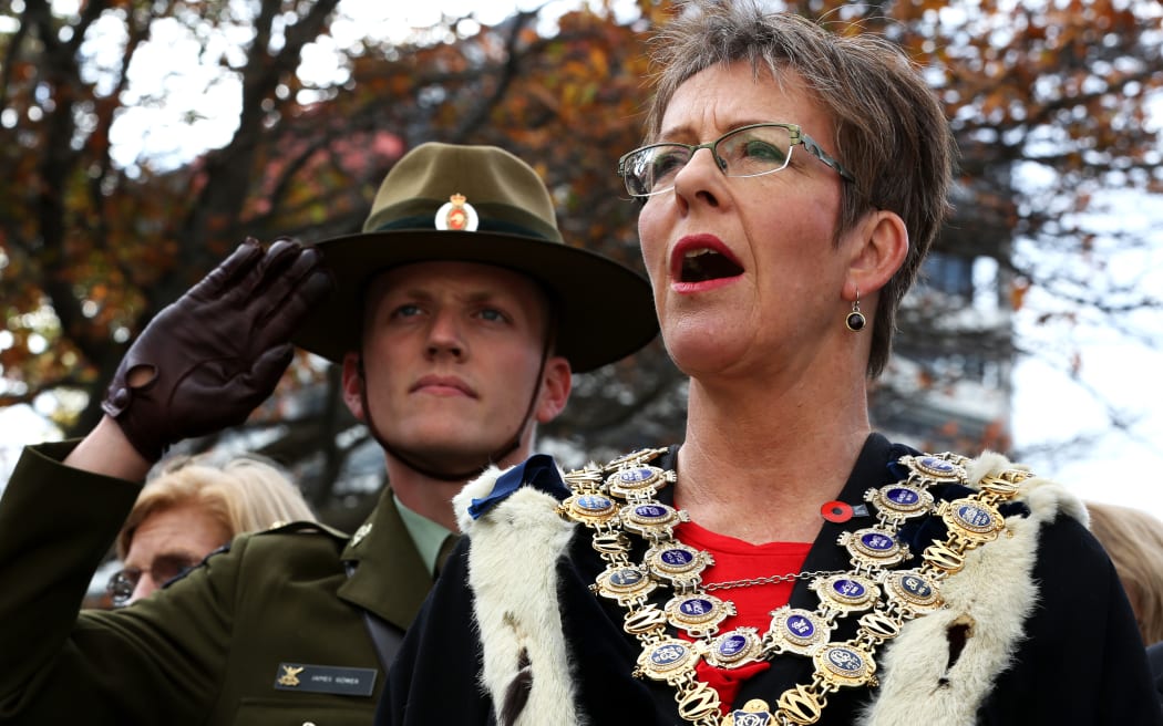 Wellington Mayor Celia Wade-Brown and a soldier paying their respects.
