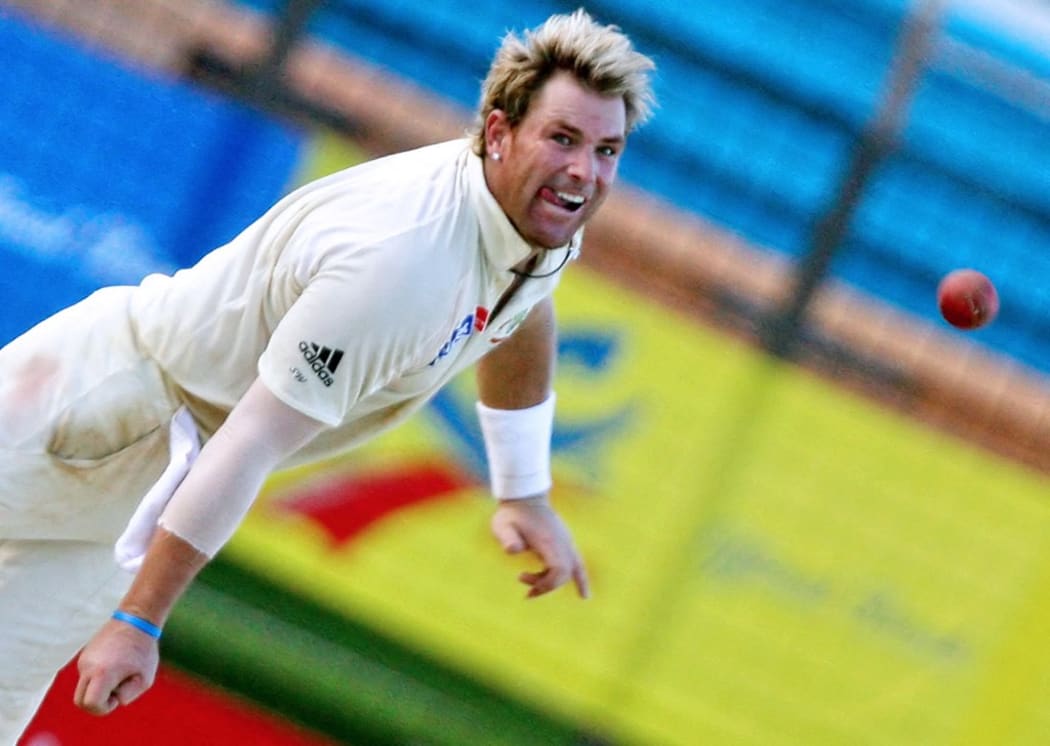 In this file photograph taken on April 19, 2006, Australian cricketer Shane Warne delivers a ball during the fourth day of the second Test match between Bangladesh and Australia at The Chittagong Divisional Stadium in Chittagong.