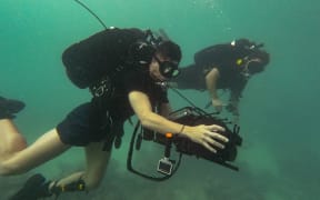 Naval Divers searching for bombs at Nanumea in Tuvalu