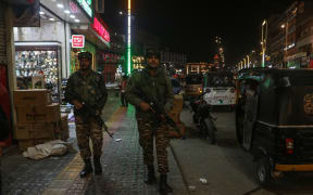 Indian paramilitary personnel patrol along a road in Srinagar, Jammu And Kashmir on April 22, 2025. Suspected militants opened fire on a group of tourists in Pahalgam, a popular hill station and tourist destination. At least 20 people are feared dead, and several others were injured after the attack in India's Himalayan territory of Jammu and Kashmir on Tuesday, with officials saying it was one of the deadliest such attacks in recent times. (Photo by Firdous Nazir/NurPhoto) (Photo by Firdous Nazir / NurPhoto / NurPhoto via AFP)