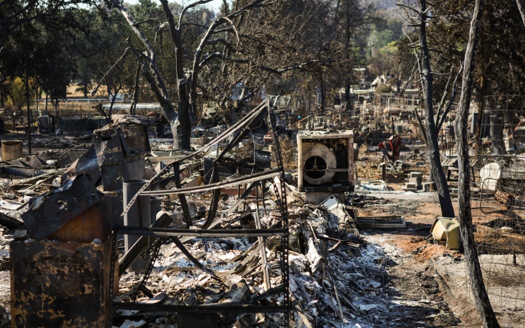 Burned residences are seen in a fire-ravaged neighborhood after the Clayton Fire burned through Lower Lake, California