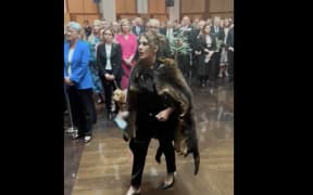 Australian Senator Lydia Thorpe approaches King Charles in Canberra.