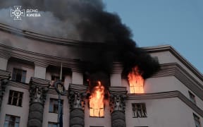 This handout photograph taken and released by Ukrainian State Emergency Service on September 7, 2025, shows a fire at the Ukrainian government building in Kyiv, following an overnight attack, amid the Russian invasion of Ukraine. Russia fired its biggest-ever aerial barrage at Ukraine early on September 7, setting the seat of the Ukrainian government in Kyiv ablaze, authorities said. (Photo by Handout / Ukrainian State Emergency Service / AFP) / RESTRICTED TO EDITORIAL USE - MANDATORY CREDIT "AFP PHOTO /  UKRAINIAN STATE EMERGENCY SERVICE " - HANDOUT - NO MARKETING NO ADVERTISING CAMPAIGNS - DISTRIBUTED AS A SERVICE TO CLIENTS