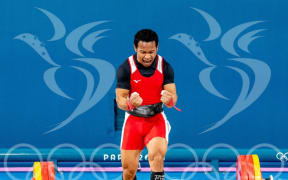 PNG's Morea Baru finished 5th place overall in the men’s 61kg weightlifting competition. Photo: Kirk Corrie/ONOC