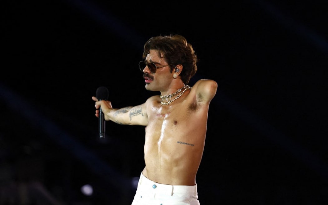 French singer Lucky Love performs at the Place de la Concorde during the Paris 2024 Paralympic Games Opening Ceremony in Paris on August 28, 2024. (Photo by Gonzalo Fuentes / POOL / AFP)