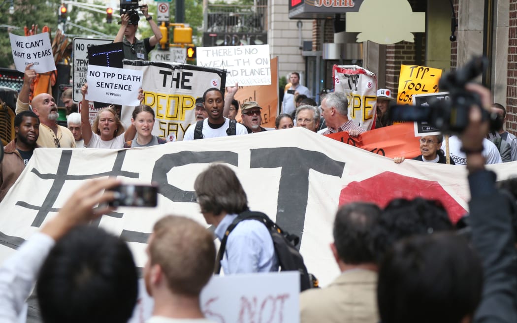 Protesters against the TPP trade talks outside the hotel in Atlanta where negotiations are taking place.