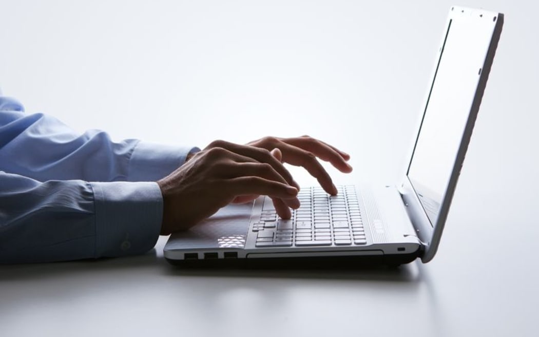 Male hands on a laptop