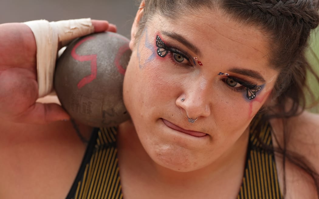 Chase Jackson competes in the women's shot put final rocking butterfly-themed makeup.