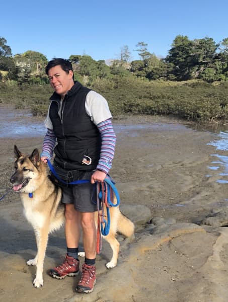 Billy Douglas, founder of Lil Luka Dog Walks, with a German shepherd dog.