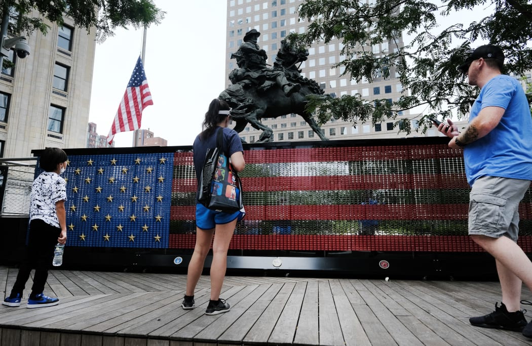 NEW YORK, NEW YORK - AUGUST 31: People visit a monument made of dog tags of fallen troops from the Global War on Terror at Liberty Park on the World Trade Center campus on August 31, 2021 in New York City.