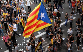 About 300,000 people took to the streets of Barcelona in protest at police actions during Sunday's referendum