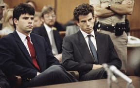 Lyle Menendez, left, and his brother, Erik, sit in Beverly Hills Municipal Court in Beverly Hills, California, on March 12, 1990.