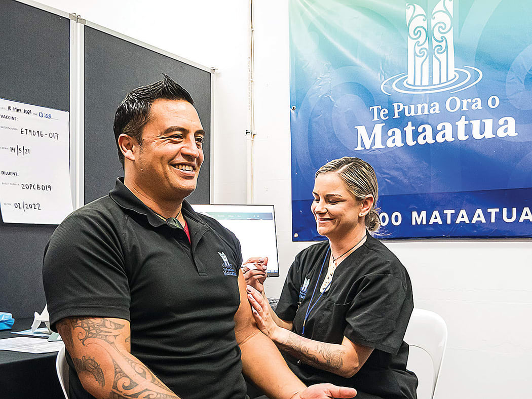 Te Puna Ora o Mataatua contracts manager Arapeta Taitoko is all smiles as he receives his vaccine from Kelly Gavin.