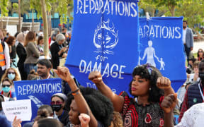 Climate activists demonstrate at the Sharm el-Sheikh International Convention Centre, in Egypt's Red Sea resort city of the same name, during the COP27 climate conference on November 17, 2022.