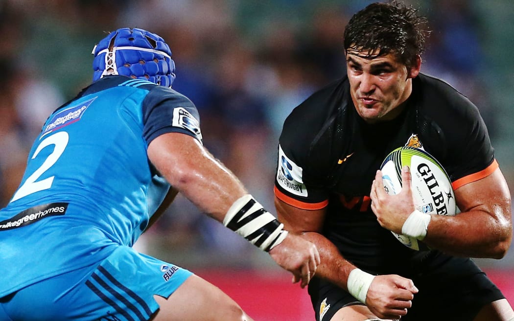 Tomas Lezana of the Jaguares charges James Parsons.