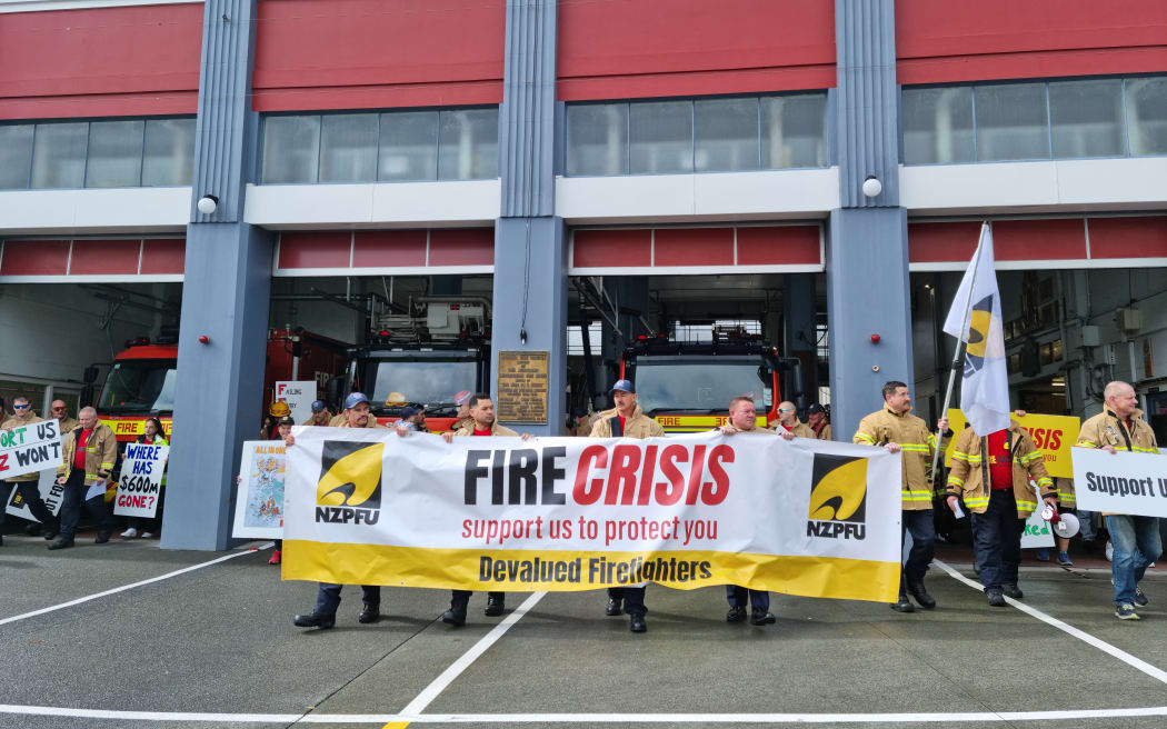 Firefighters on strike outside Auckland Central Fire Station.