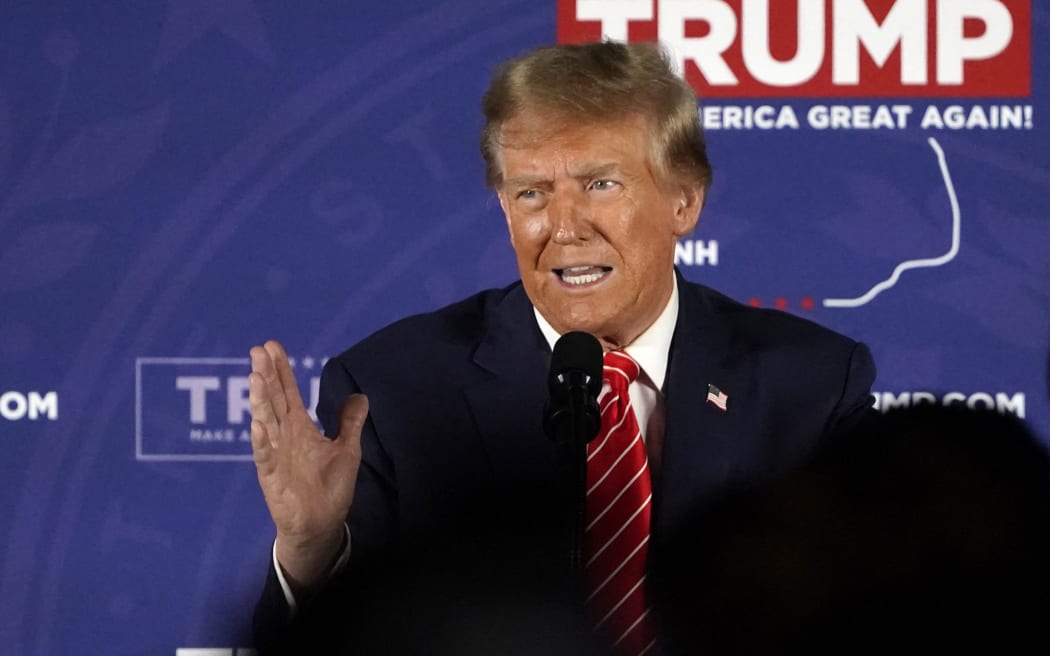 Republican presidential hopeful and former US President Donald Trump gestures as he speaks during a rally in Laconia, New Hampshire, January 22, 2024. (Photo by TIMOTHY A. CLARY / AFP)