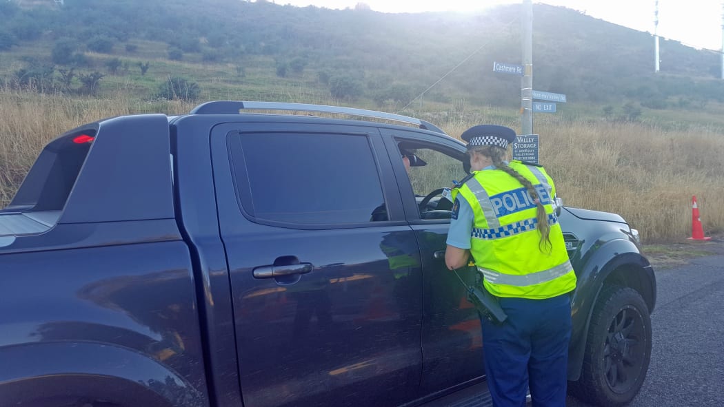 The Hoon Hay Valley Rd cordon lifts to residents. Photo taken 21 February.