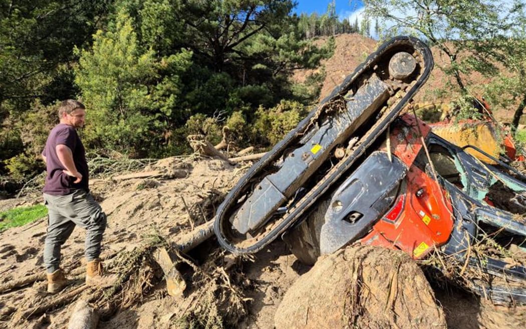 McEnroe and his mangled digger worth about $80,000.