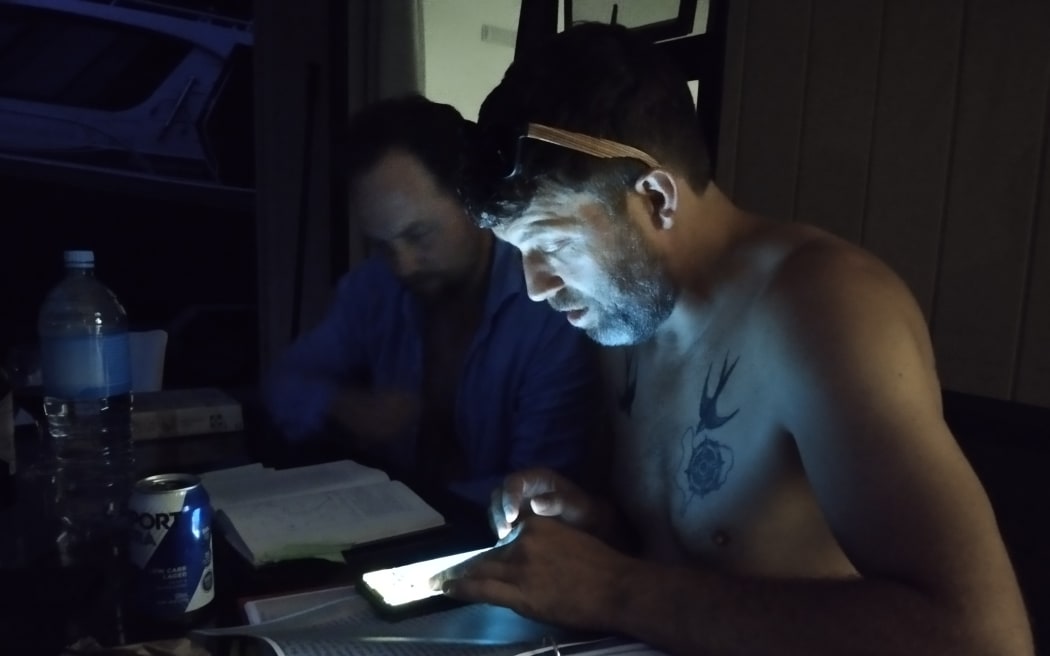 Kelly Wither and Brendan Wade look over maps.