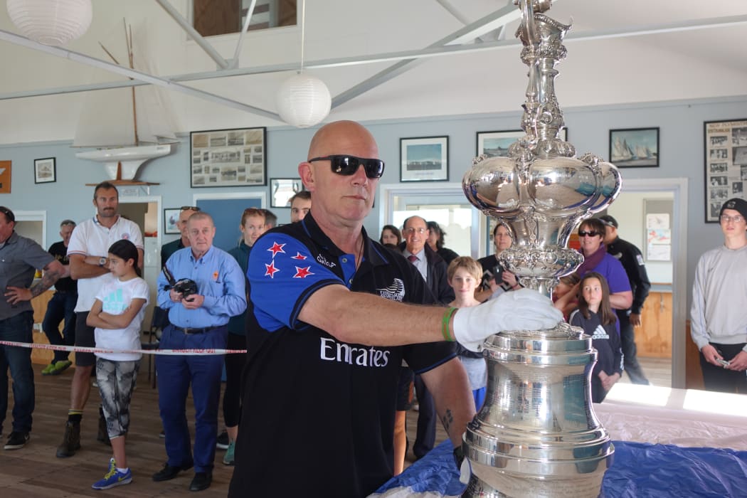 Norm Newton delivers the America's Cup to the New Plymouth Yacht Club.