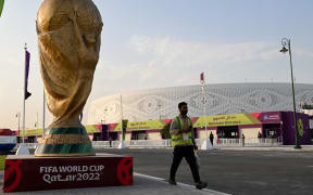 A man walks outside the Al-Thumama Stadium in Doha on November 8, 2022, ahead of the Qatar 2022 FIFA World Cup football tournament. (Photo by Kirill KUDRYAVTSEV / AFP)