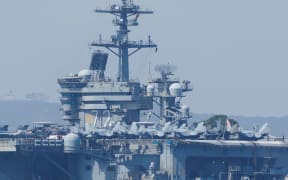 The USS Abraham Lincoln, a Nimitz-class nuclear-powered aircraft carrier, is seen at Naval Air Station North Island in San Diego, California, on 11 August, 2025.