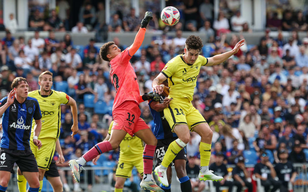 Auckland FC's Alexander Paulsen up against Wellington Phoenix's Isaac Hughes. A-League Men, Round 7, Auckland FC v Wellington Phoenix, Go Media Stadium, Auckland, Saturday 7 December 2024. Copyright Photo: Shane Wenzlick / www.photosport.nz