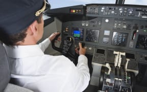Pilot in airplane cockpit
