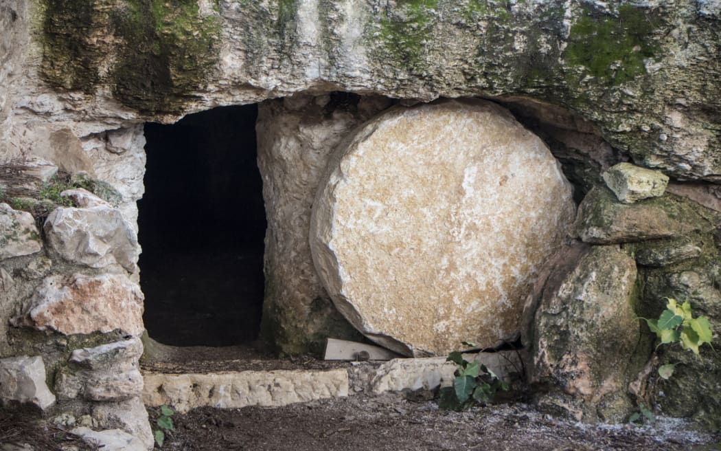 Empty tomb with stone door rolled away