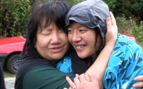 Susan O'Brien and mother Maggie Khoo embracing