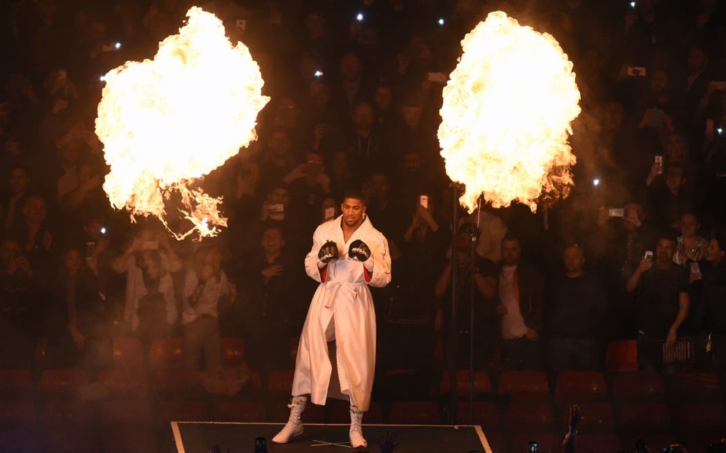 IBF and WBA world heavyweight champion Anthony Joshua of Great Britain enters the ring for his unification bout against New Zealand's WBO champion Joseph Parker at Principality Stadium in Cardiff, March 31, 2018.