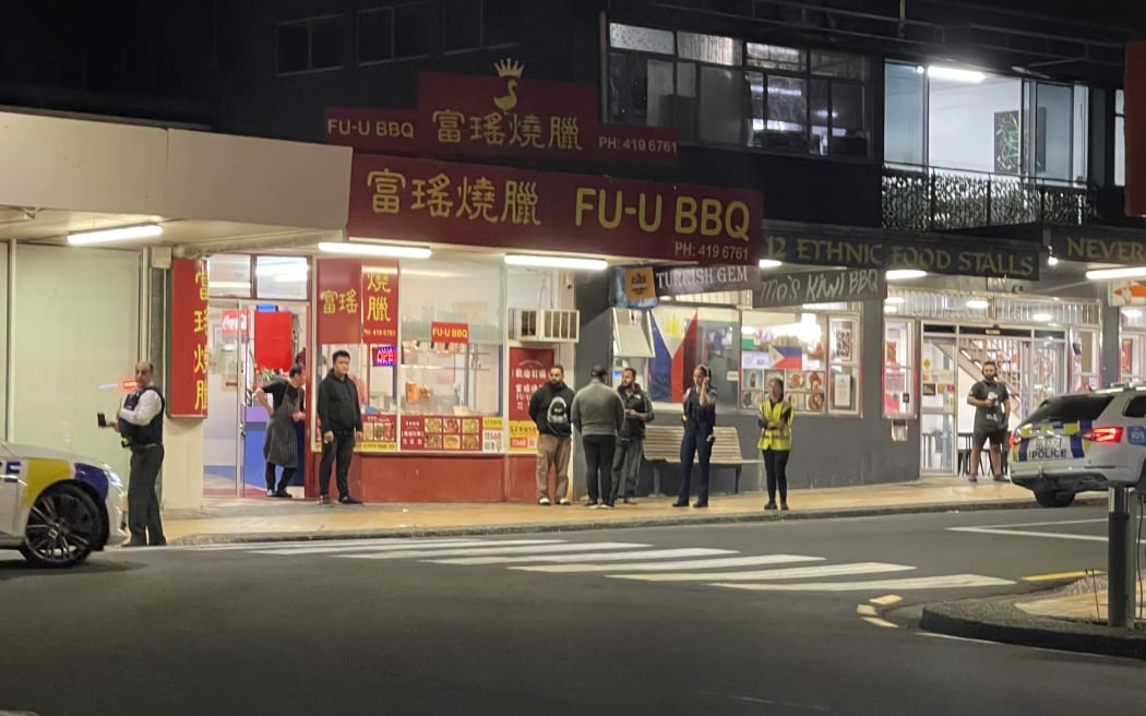Police took at least one person into custody after responding to an incident at Northcote Liquor, Pearn Crescent, Auckland, on 25 May, 2025.