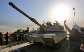 Iraqi forces deploy in the area of al-Shourah, some 45 kms south of Mosul, as they advance towards the city to retake it from the Islamic State.