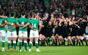 Ireland players look on as the New Zealand players perform The Haka prior to during the Rugby World Cup 2019 Quarter Final match