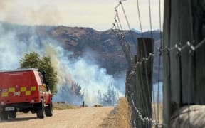 A large grassfire was threatening structures in the Springvale area near Clyde in Central Otago on 25 February 2026. Photo / Kaden Campbell