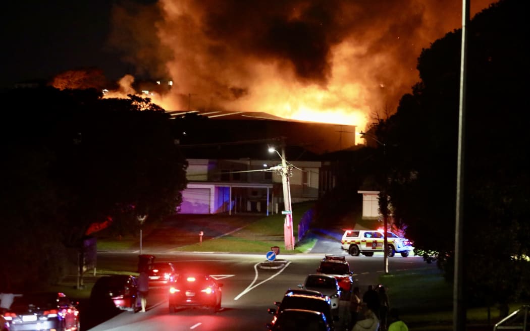 At least 60 residents are lining the streets watching the fire despite Fire and Emergency warning people to stay inside.