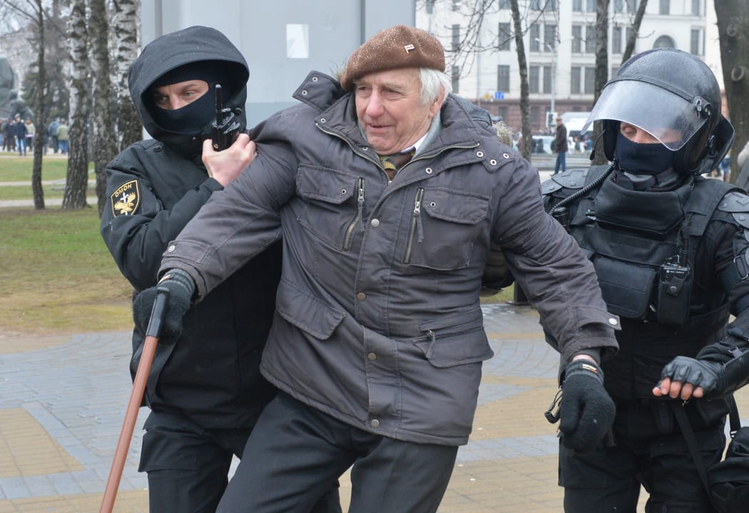 Riot police stand ready during an unauthorized protest in Minsk over the tax on those employed less than 183 days a year, labelled "social parasites".