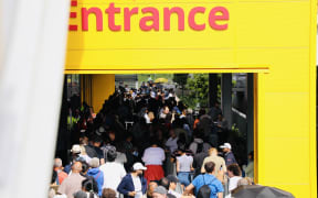 People queue to enter IKEA on its opening day in Auckland