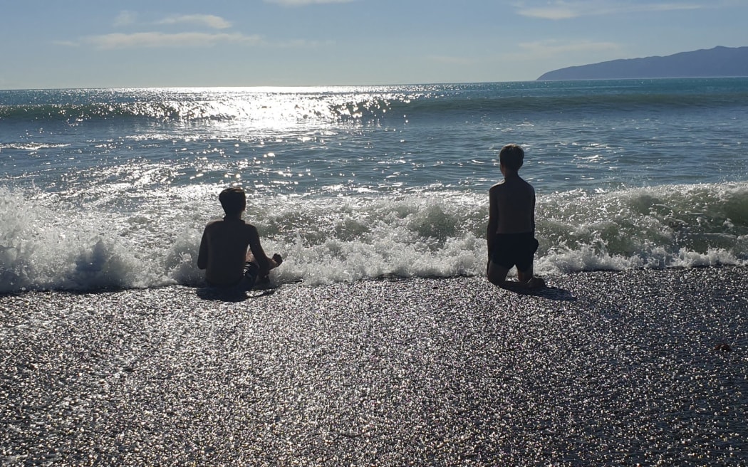 Children in the waves at Ngawi.