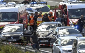 Emergency services surround the BMW after a high-speed motorway chase